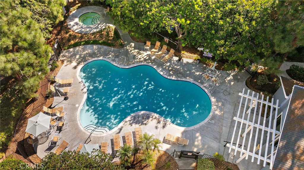 25611 Quail Run, Unit 131 Dana Point, CA 92629 - Photo 15 of 25 a view of a swimming pool with a garden