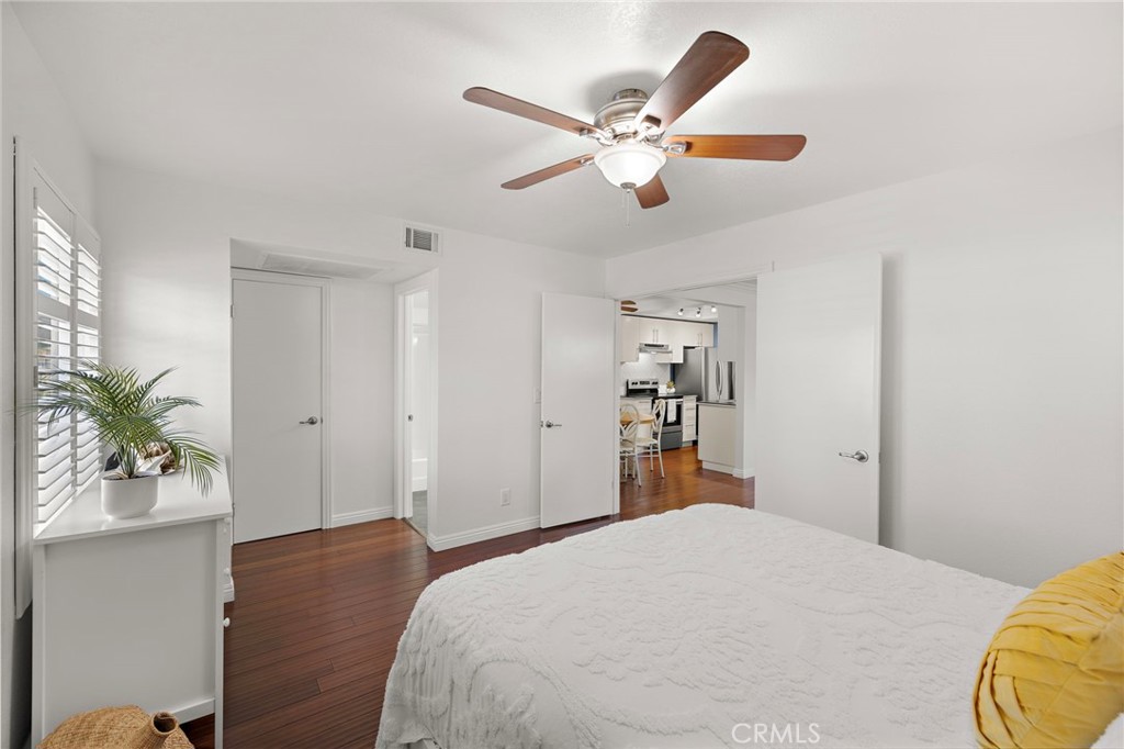 25611 Quail Run, Unit 131 Dana Point, CA 92629 - Photo 9 of 25 a bedroom with a bed and a chandelier