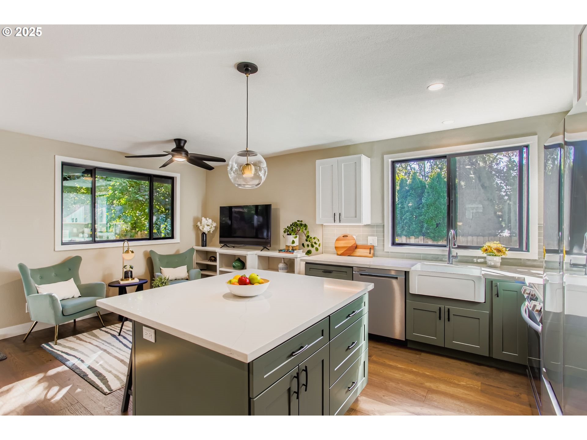 8409 Southwest Jamieson Road Portland, OR 97225 - Photo 12 of 28 a kitchen with a sink a stove a refrigerator and wooden cabinets