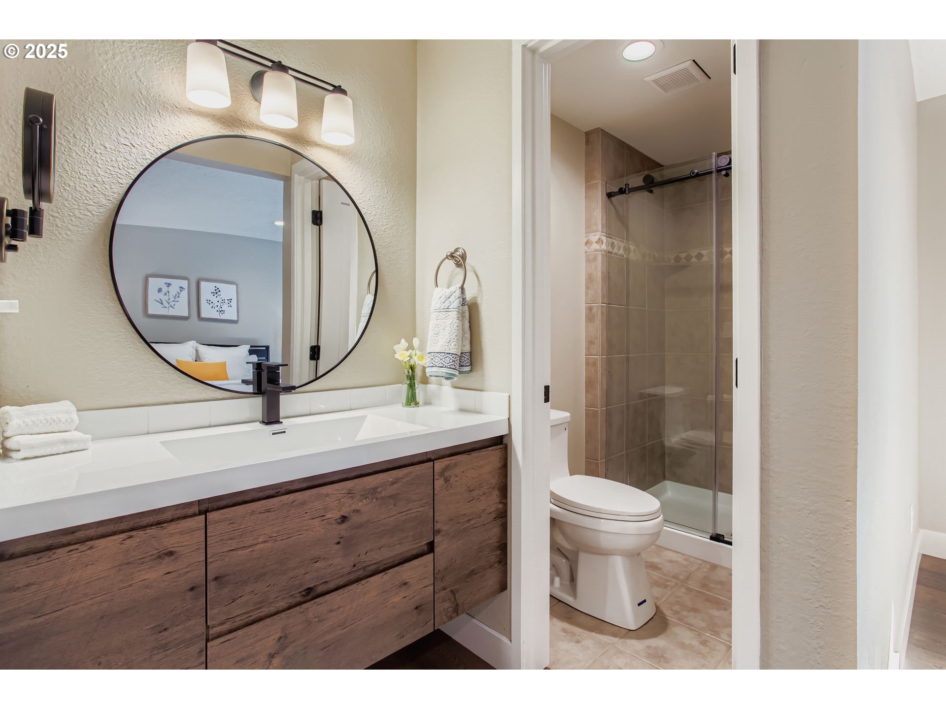 8409 Southwest Jamieson Road Portland, OR 97225 - Photo 18 of 28 a bathroom with a toilet a sink and mirror