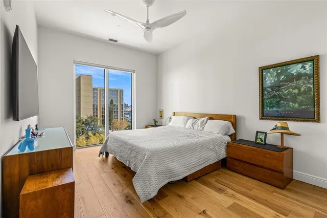 a bedroom with a bed and a couch