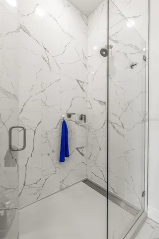 a bathroom with a bathtub and shower