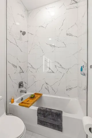 a bathroom with a bath tub and a shower