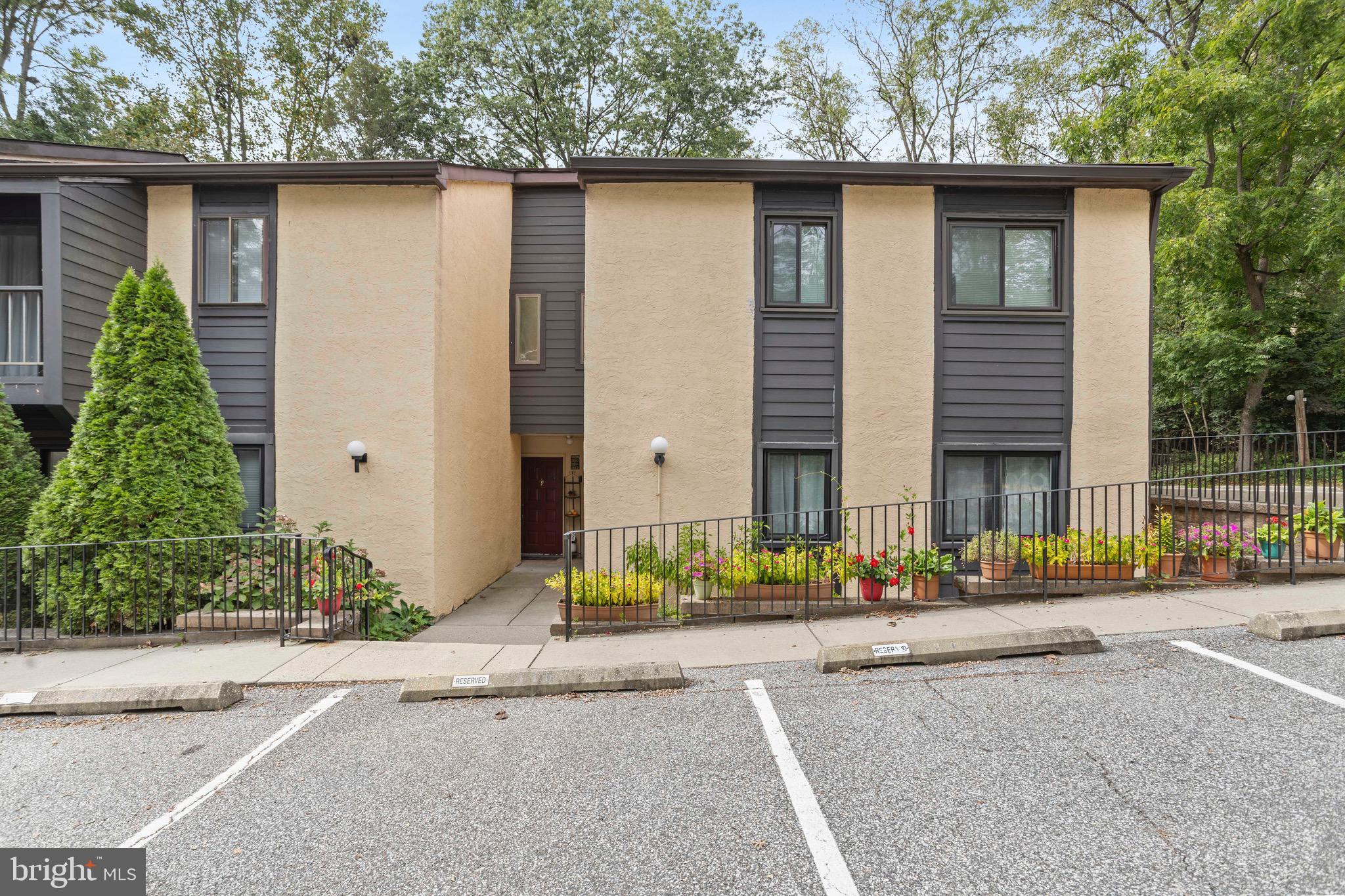 1511 Painters Crossing, Unit 1511 Chadds Ford, PA 19317 - Photo 1 of 17 front view of a house with a street