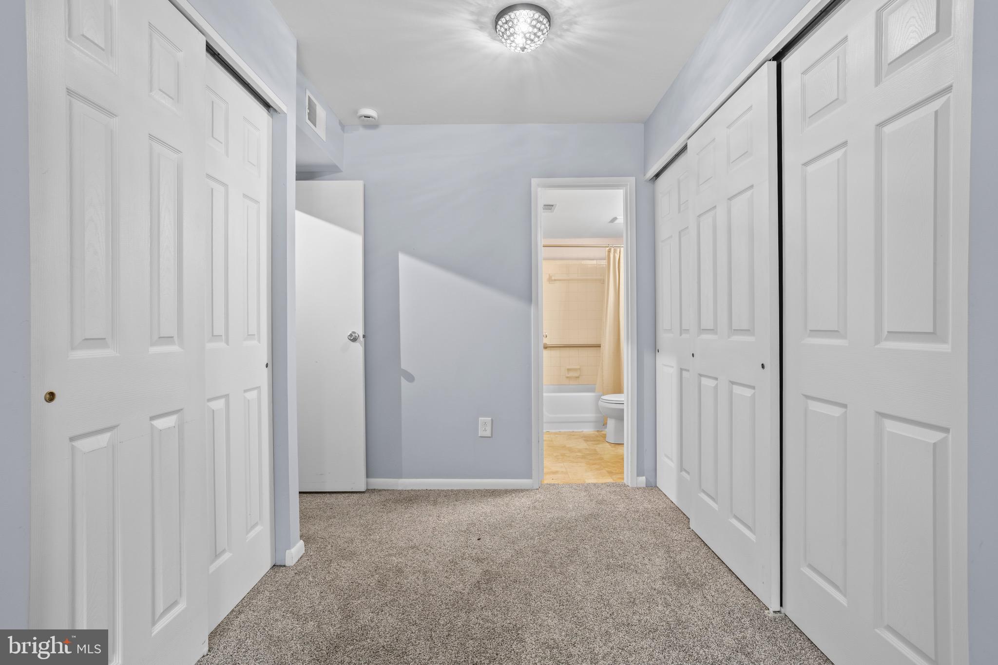 1511 Painters Crossing, Unit 1511 Chadds Ford, PA 19317 - Photo 14 of 17 a view of a hallway with wooden shelves