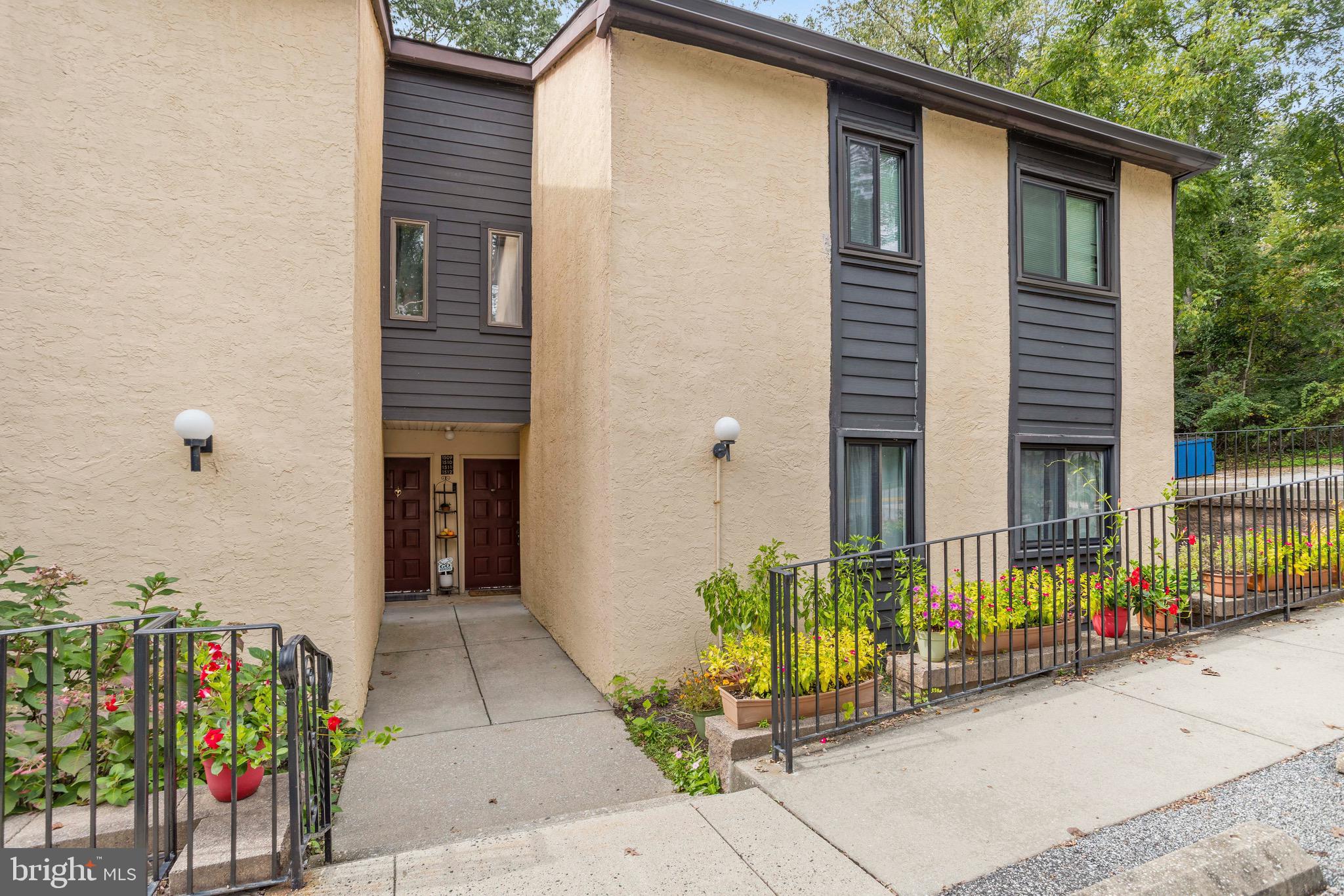 1511 Painters Crossing, Unit 1511 Chadds Ford, PA 19317 - Photo 2 of 17 a view of a house with potted plants