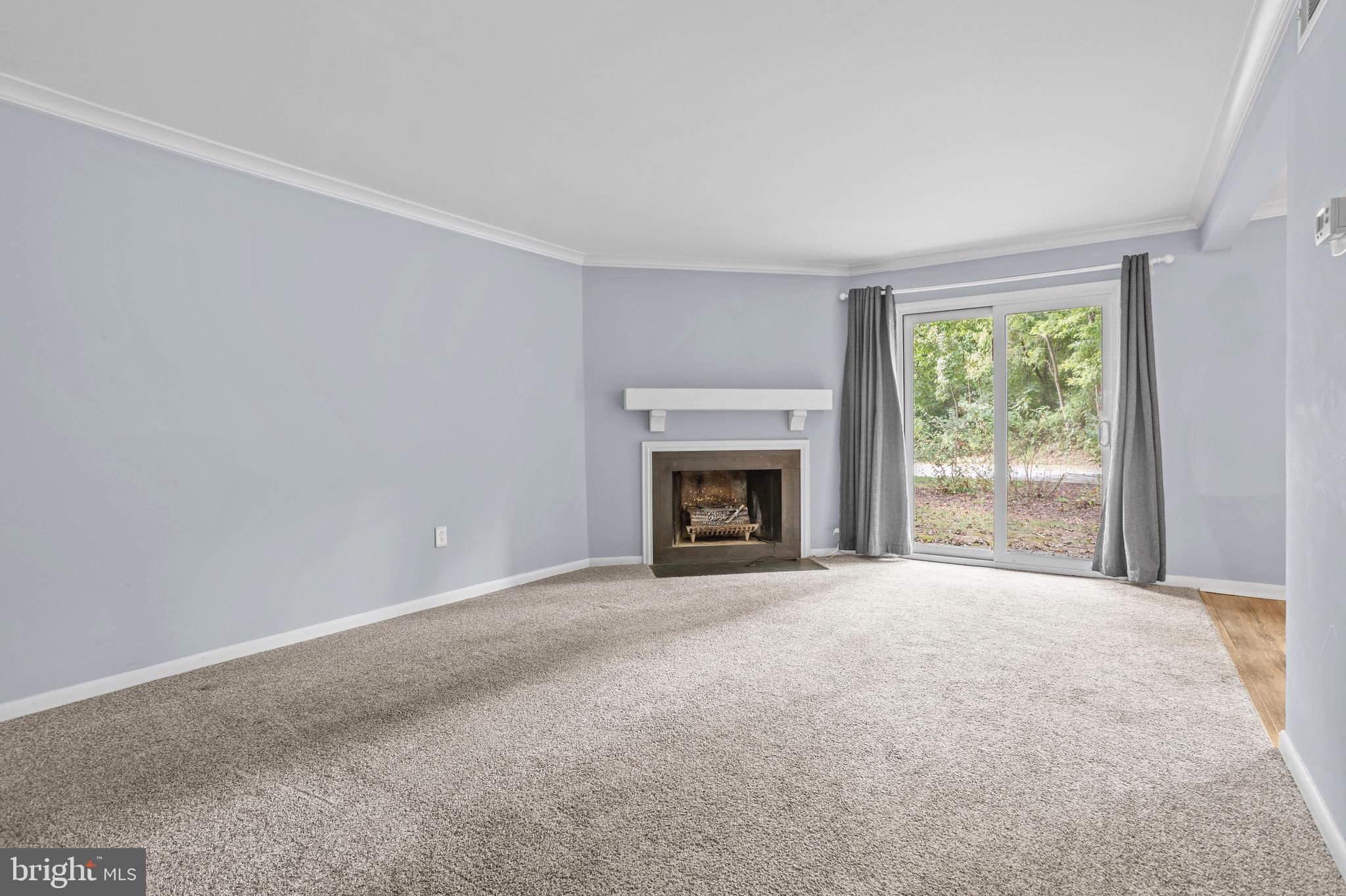 1511 Painters Crossing, Unit 1511 Chadds Ford, PA 19317 - Photo 3 of 17 a view of empty room with a fireplace