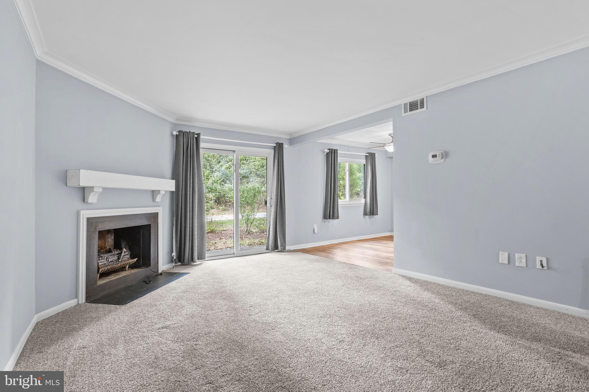 1511 Painters Crossing, Unit 1511 Chadds Ford, PA 19317 - Photo 4 of 17 a view of empty room with window and fireplace