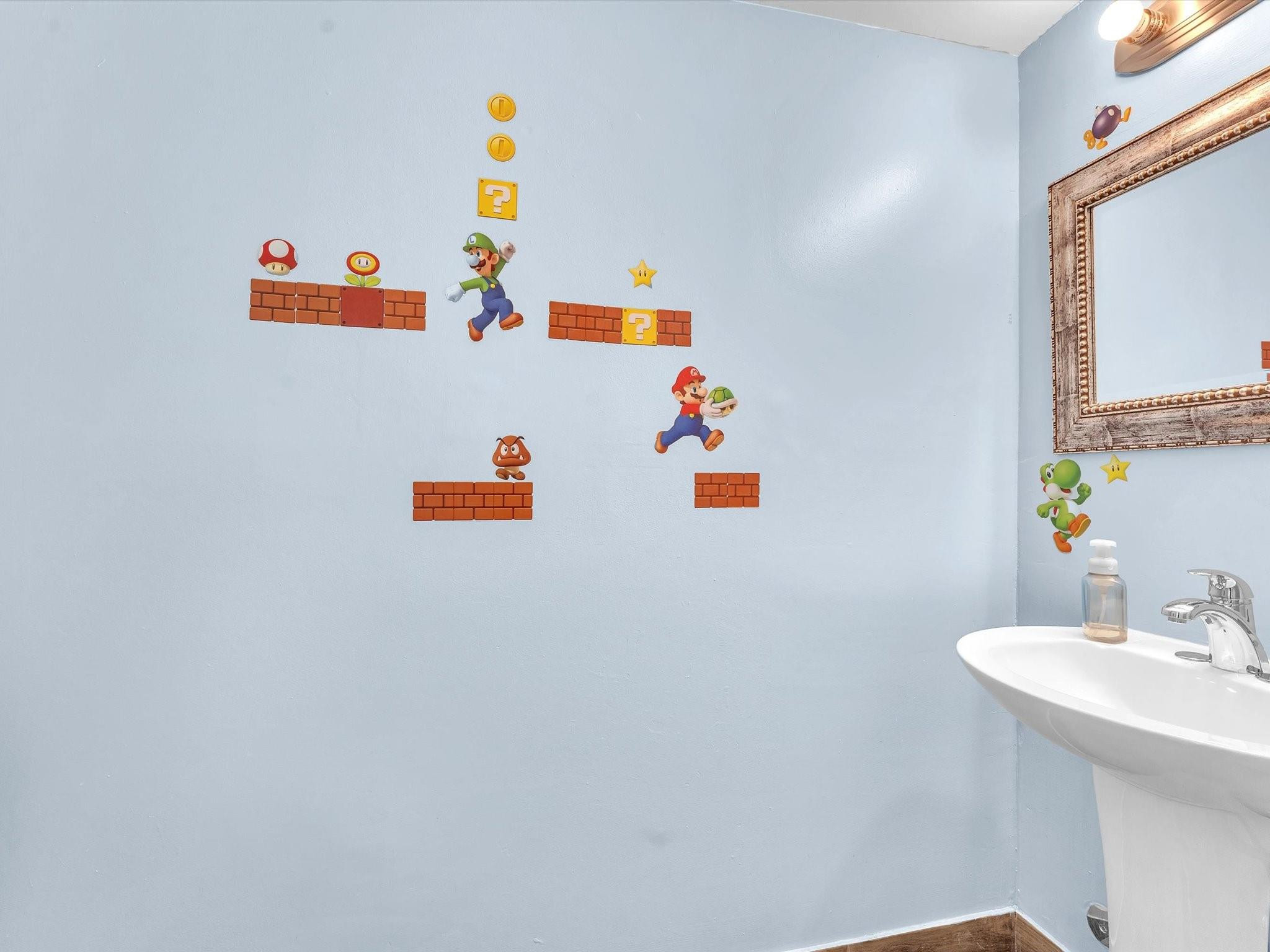 9831 Riverside Drive Coral Springs, FL 33071 - Photo 12 of 27 a bathroom with a sink and a mirror