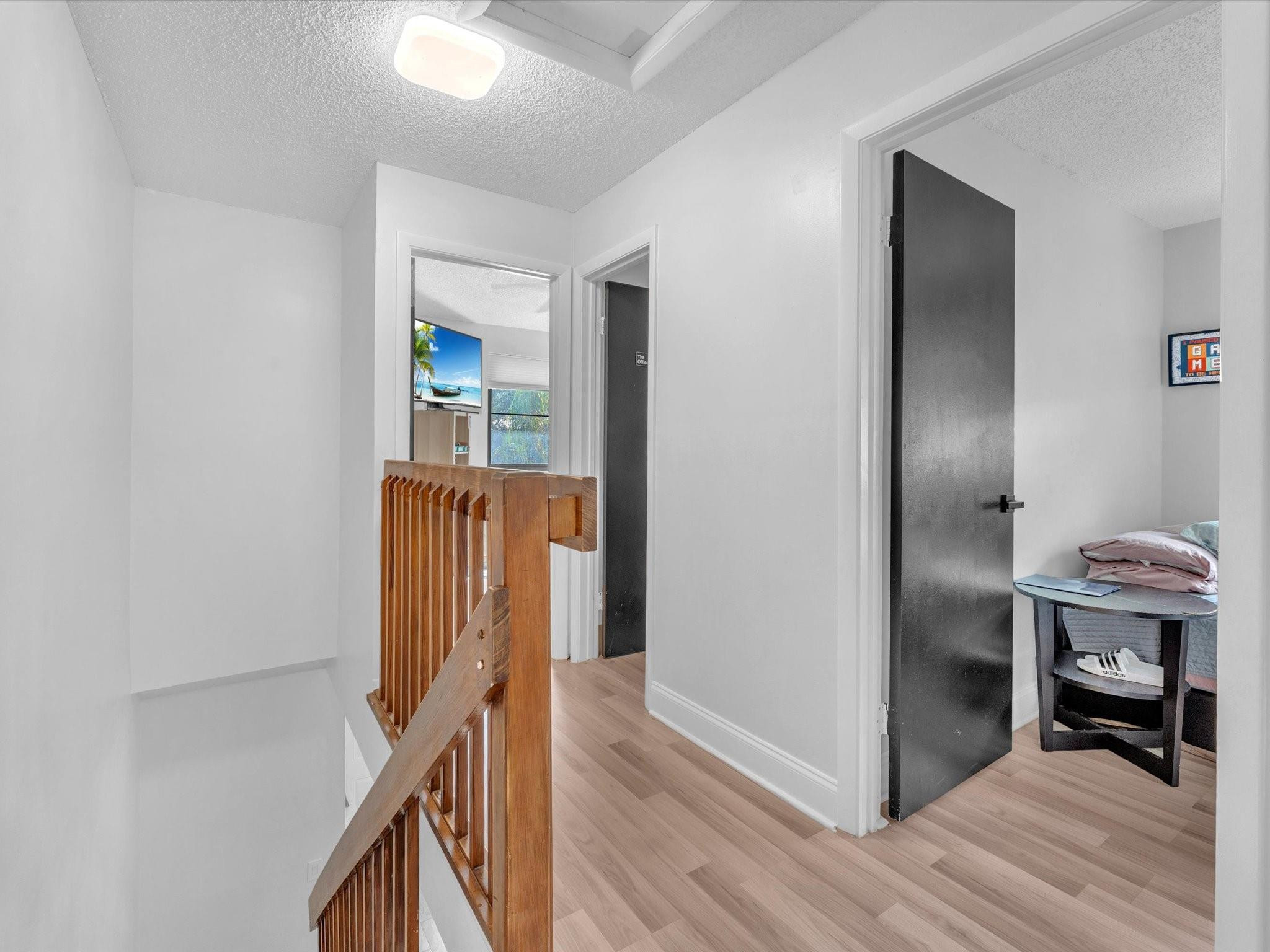 9831 Riverside Drive Coral Springs, FL 33071 - Photo 13 of 27 a view of hallway with wooden floor