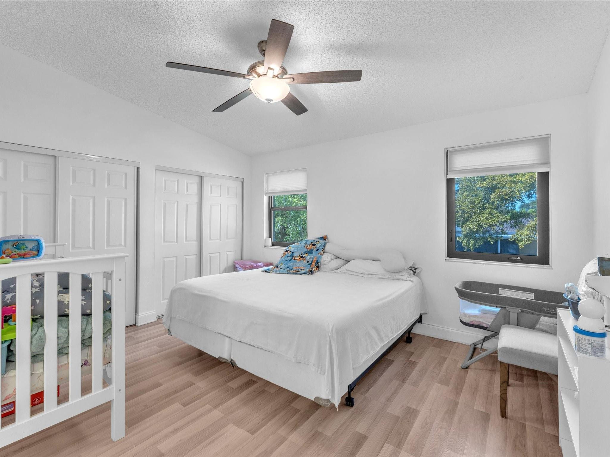 9831 Riverside Drive Coral Springs, FL 33071 - Photo 14 of 27 a large white bed in a white room
