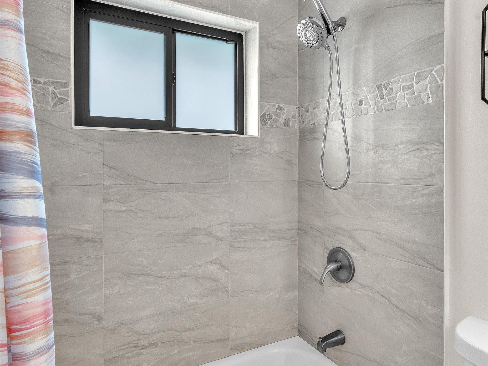 9831 Riverside Drive Coral Springs, FL 33071 - Photo 19 of 27 a bathroom with a shower