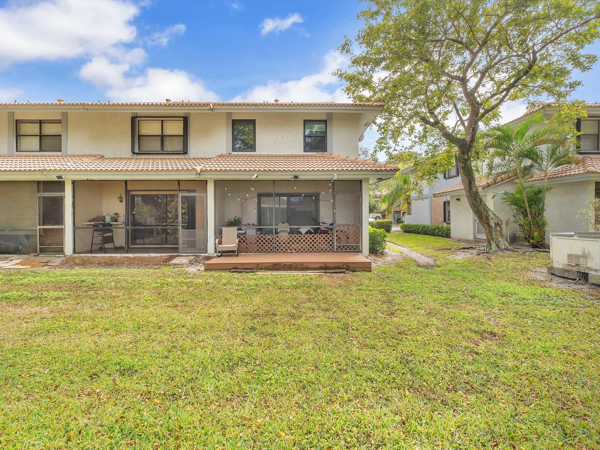 9831 Riverside Drive Coral Springs, FL 33071 - Photo 24 of 27 a house view with swimming pool in front of it