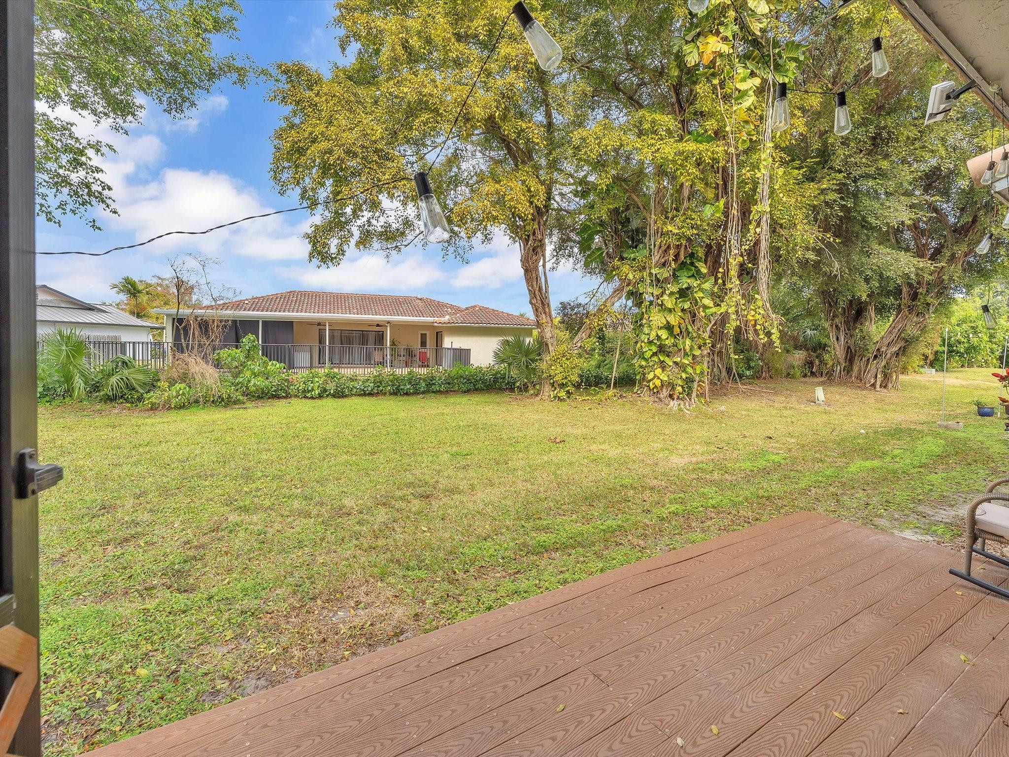 9831 Riverside Drive Coral Springs, FL 33071 - Photo 25 of 27 a view of an ocean with a garden and trees