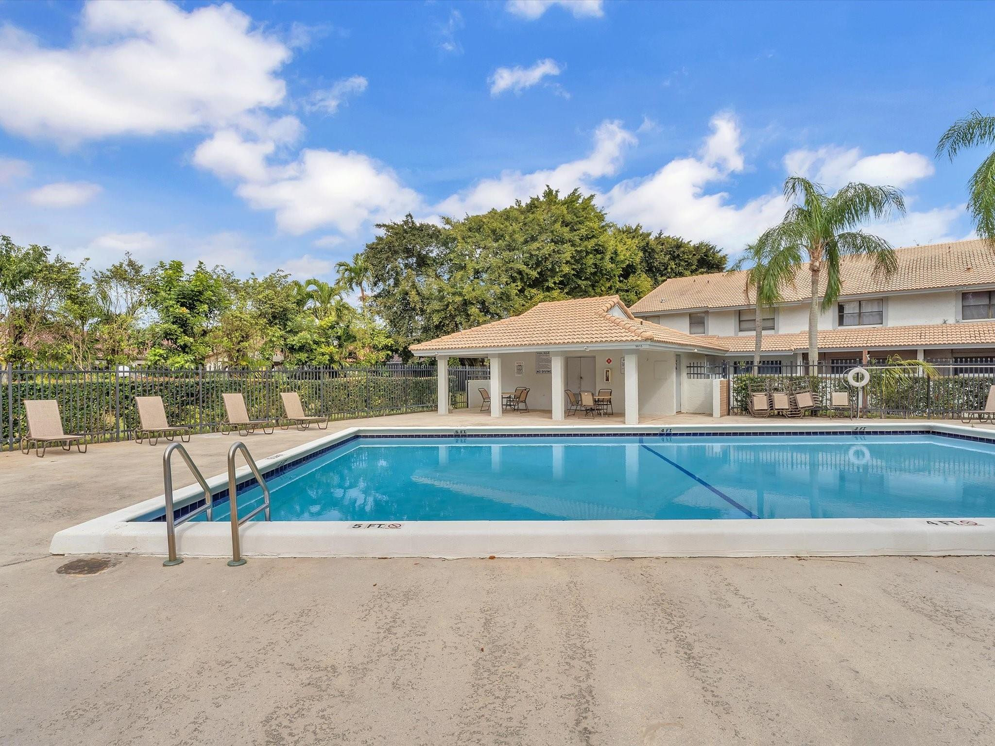 9831 Riverside Drive Coral Springs, FL 33071 - Photo 27 of 27 a front view of a house with a yard