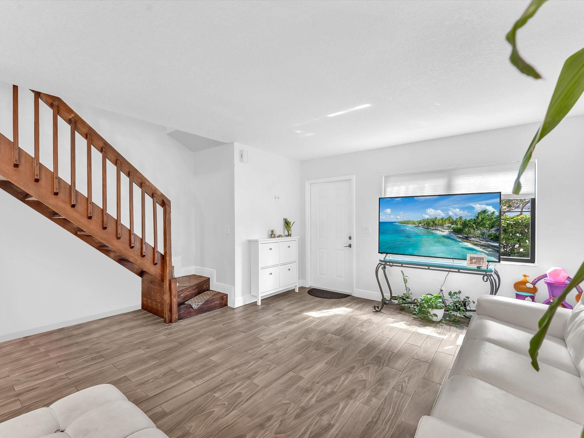 9831 Riverside Drive Coral Springs, FL 33071 - Photo 9 of 27 a view of a livingroom with furniture and staircase