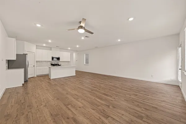a view of kitchen with wooden floor and window
