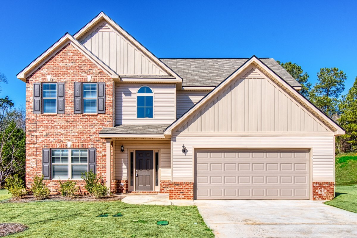 306 Longbridge Way, Unit 34 Perry, GA 31069 - Photo 1 of 1 a view of a house with a yard