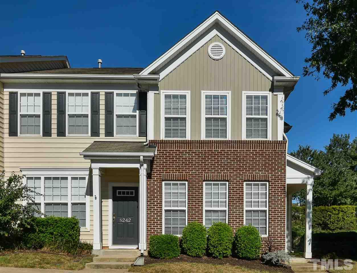 8240 City Loft Court Raleigh, NC 27613 - Photo 1 of 5 a front view of a house with a yard