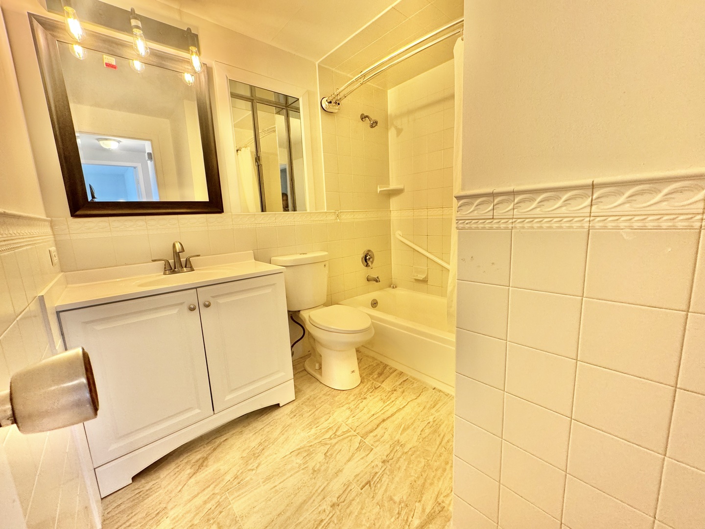 102 North Salem Drive, Unit 102 Schaumburg, IL 60193 - Photo 17 of 19 a bathroom with a sink and a mirror