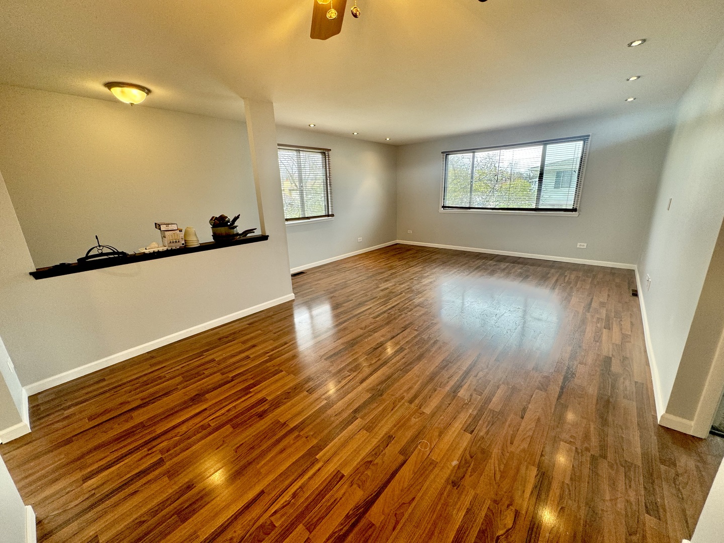 102 North Salem Drive, Unit 102 Schaumburg, IL 60193 - Photo 6 of 19 a view of an empty room with wooden floor and a window