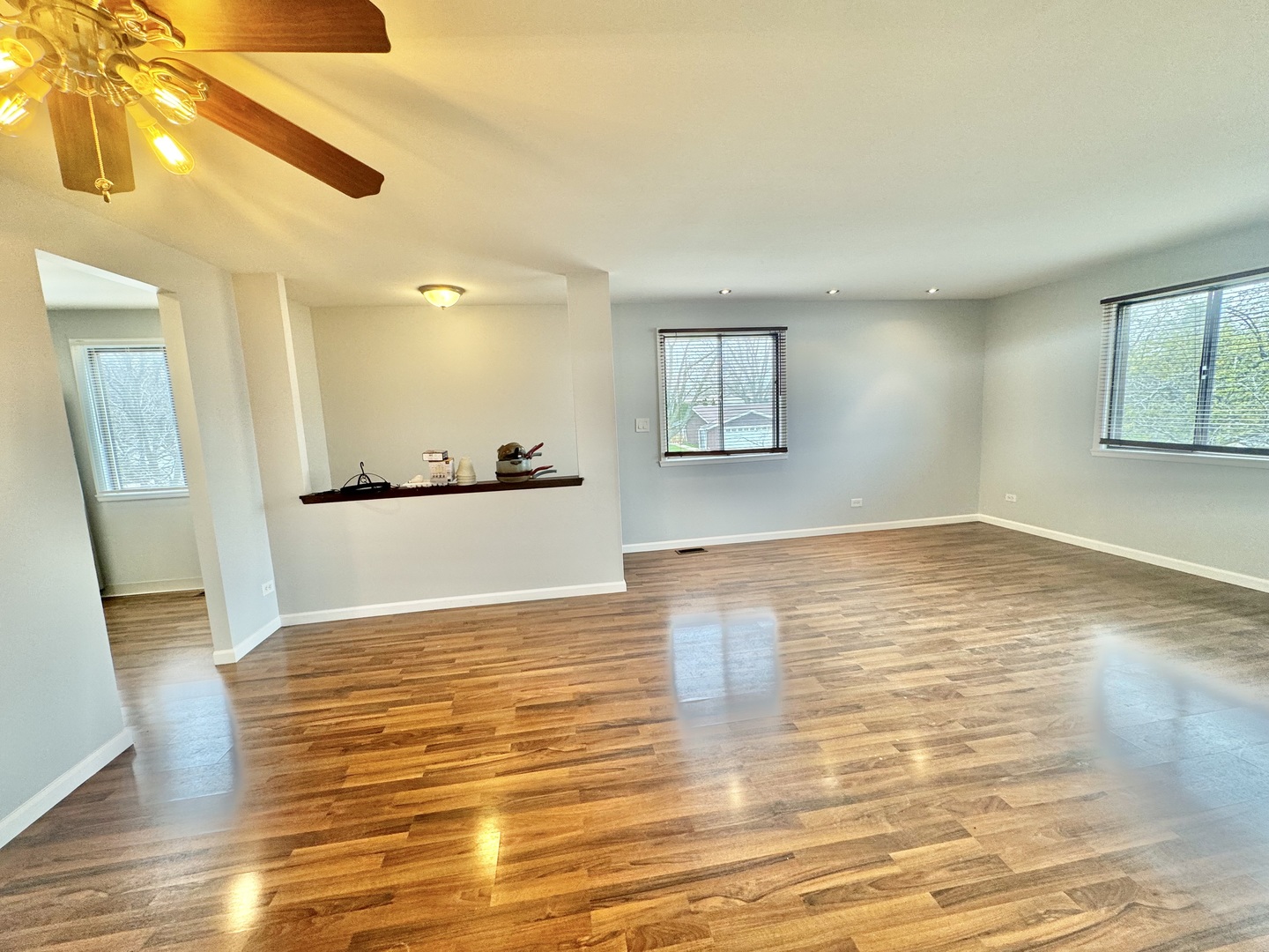 102 North Salem Drive, Unit 102 Schaumburg, IL 60193 - Photo 7 of 19 a view of empty room with wooden floor and fan