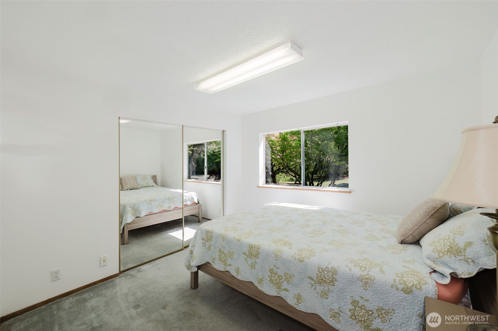 105 Schoolhouse Road Brinnon, WA 98320 - Photo 11 of 39 a bedroom with a bed and a window with outer view