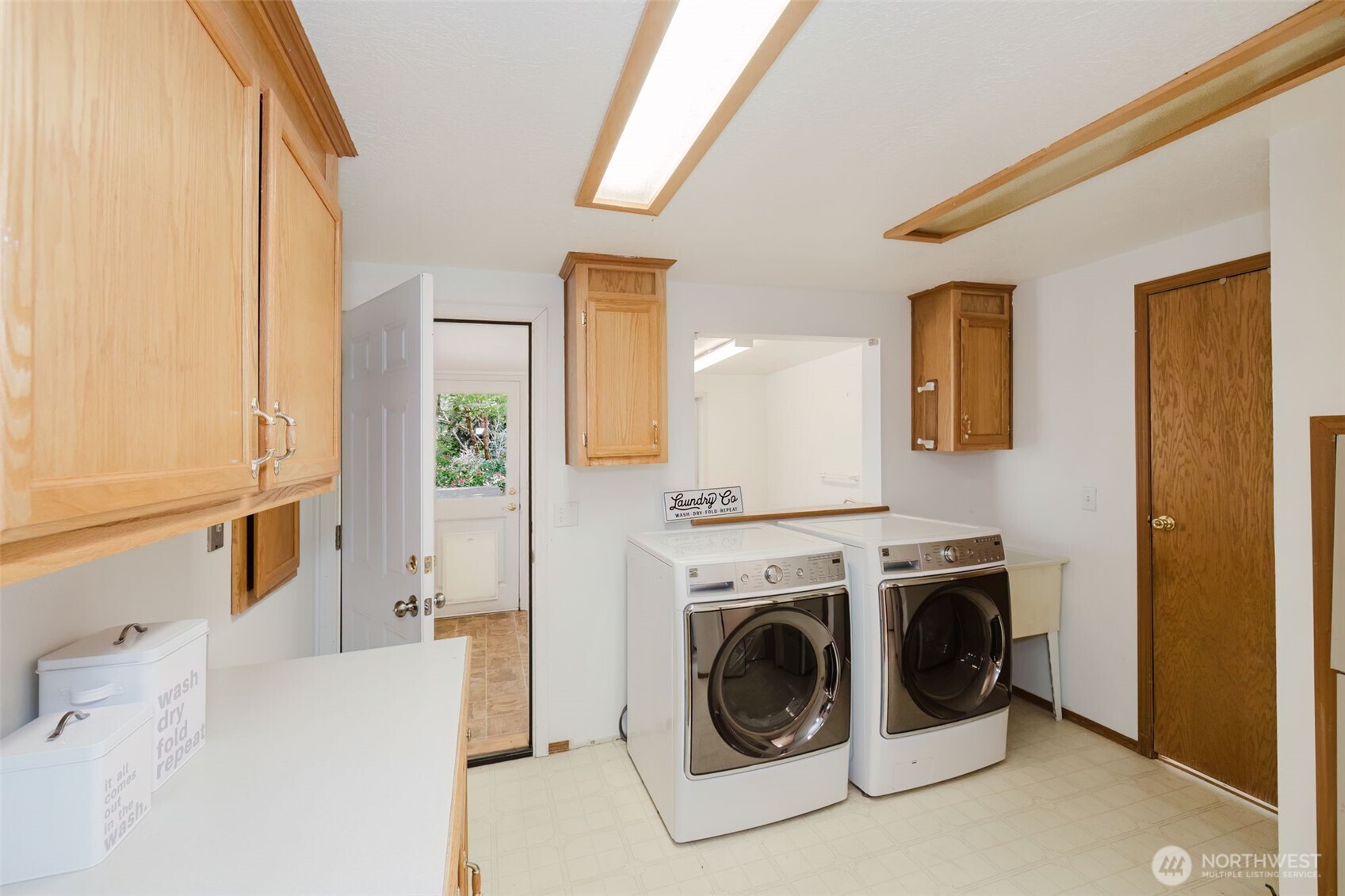 105 Schoolhouse Road Brinnon, WA 98320 - Photo 13 of 39 a view of a hallway with washer and dryer