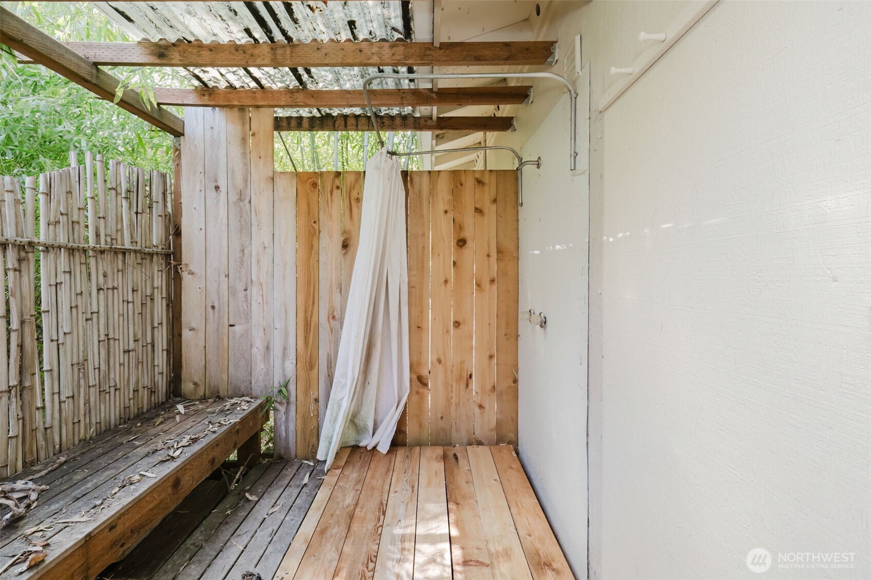 105 Schoolhouse Road Brinnon, WA 98320 - Photo 19 of 39 a view of a room with a window and wooden floor