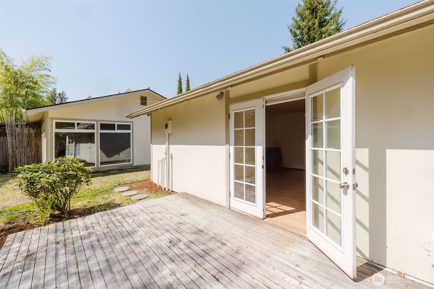 105 Schoolhouse Road Brinnon, WA 98320 - Photo 21 of 39 a front view of a house with a garden
