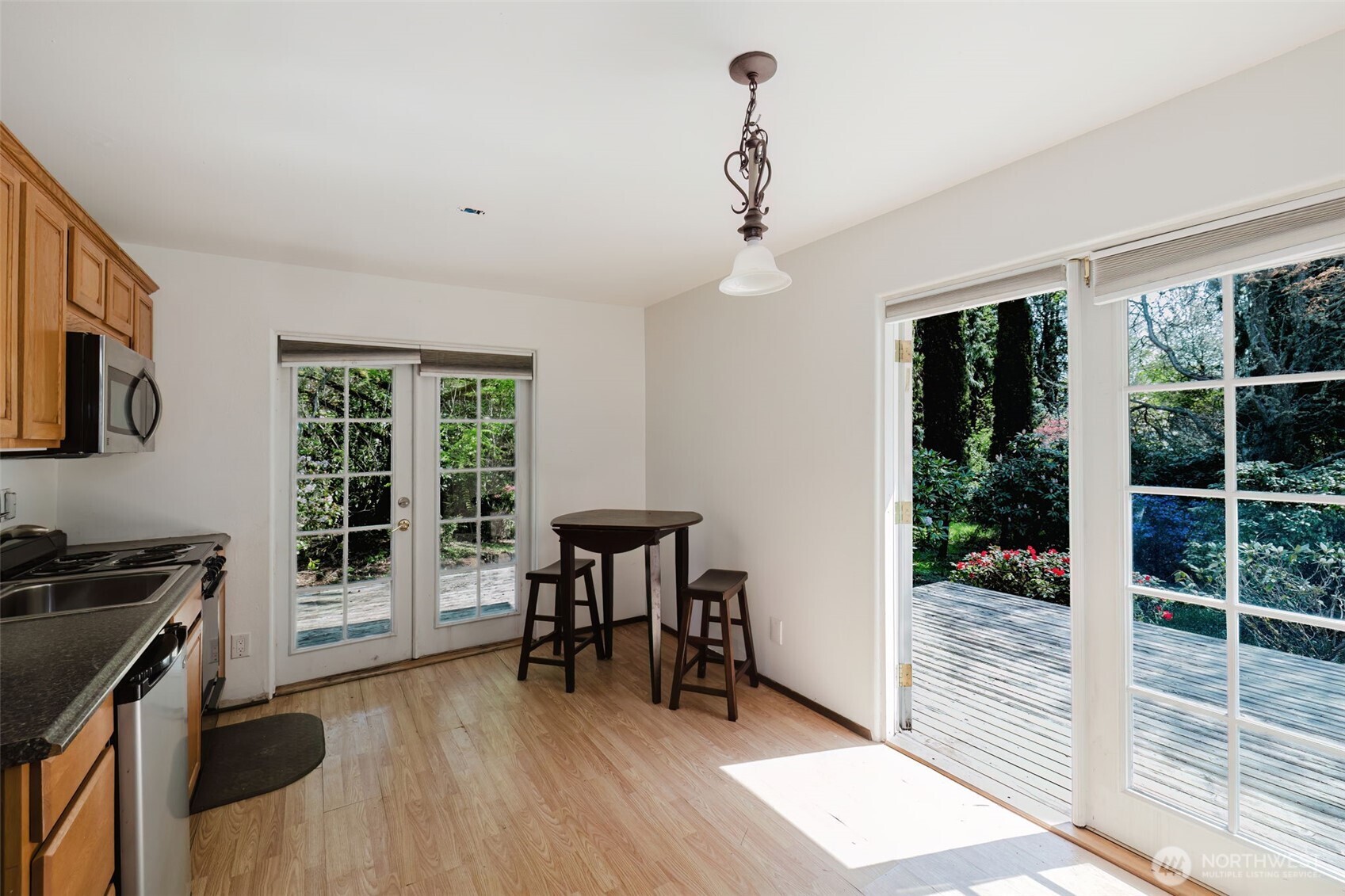 105 Schoolhouse Road Brinnon, WA 98320 - Photo 22 of 39 a view of a workspace with furniture and a window