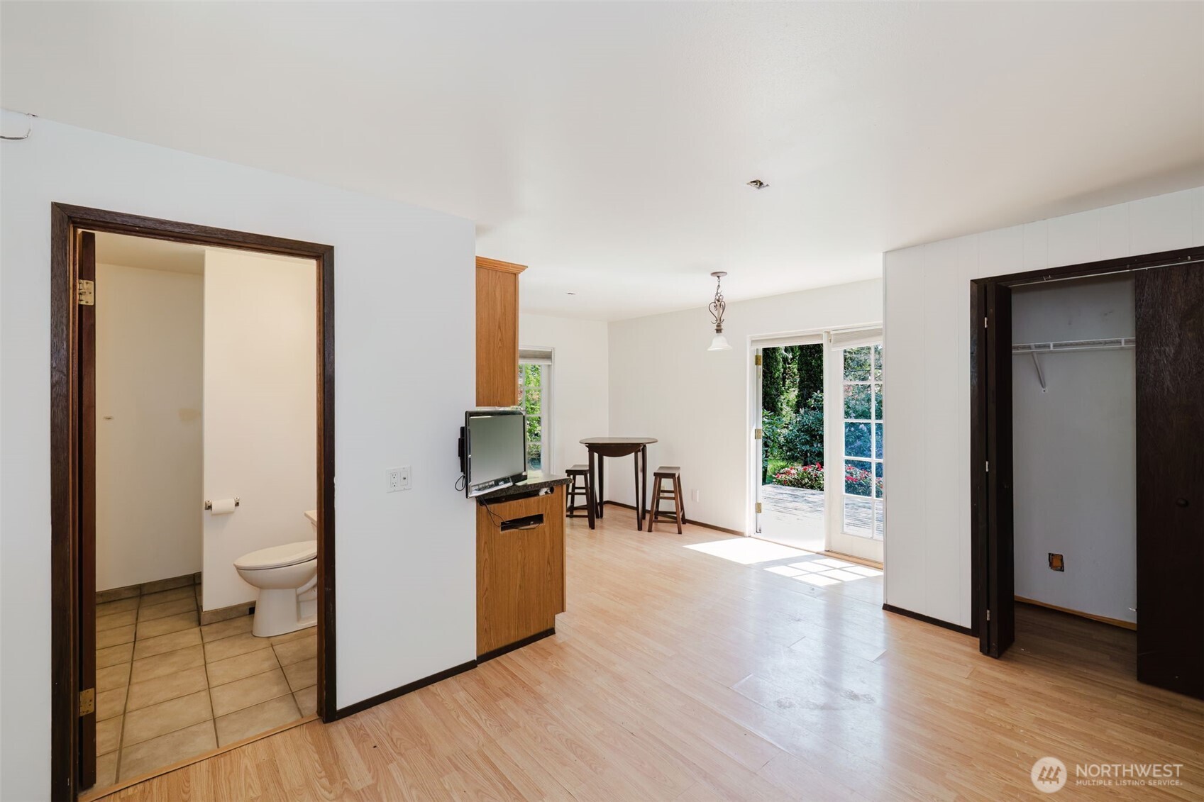 105 Schoolhouse Road Brinnon, WA 98320 - Photo 23 of 39 a kitchen with stainless steel appliances a refrigerator and wooden floor