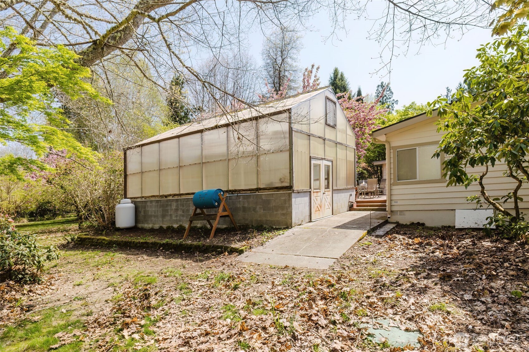 105 Schoolhouse Road Brinnon, WA 98320 - Photo 25 of 39 a view of a house with a yard