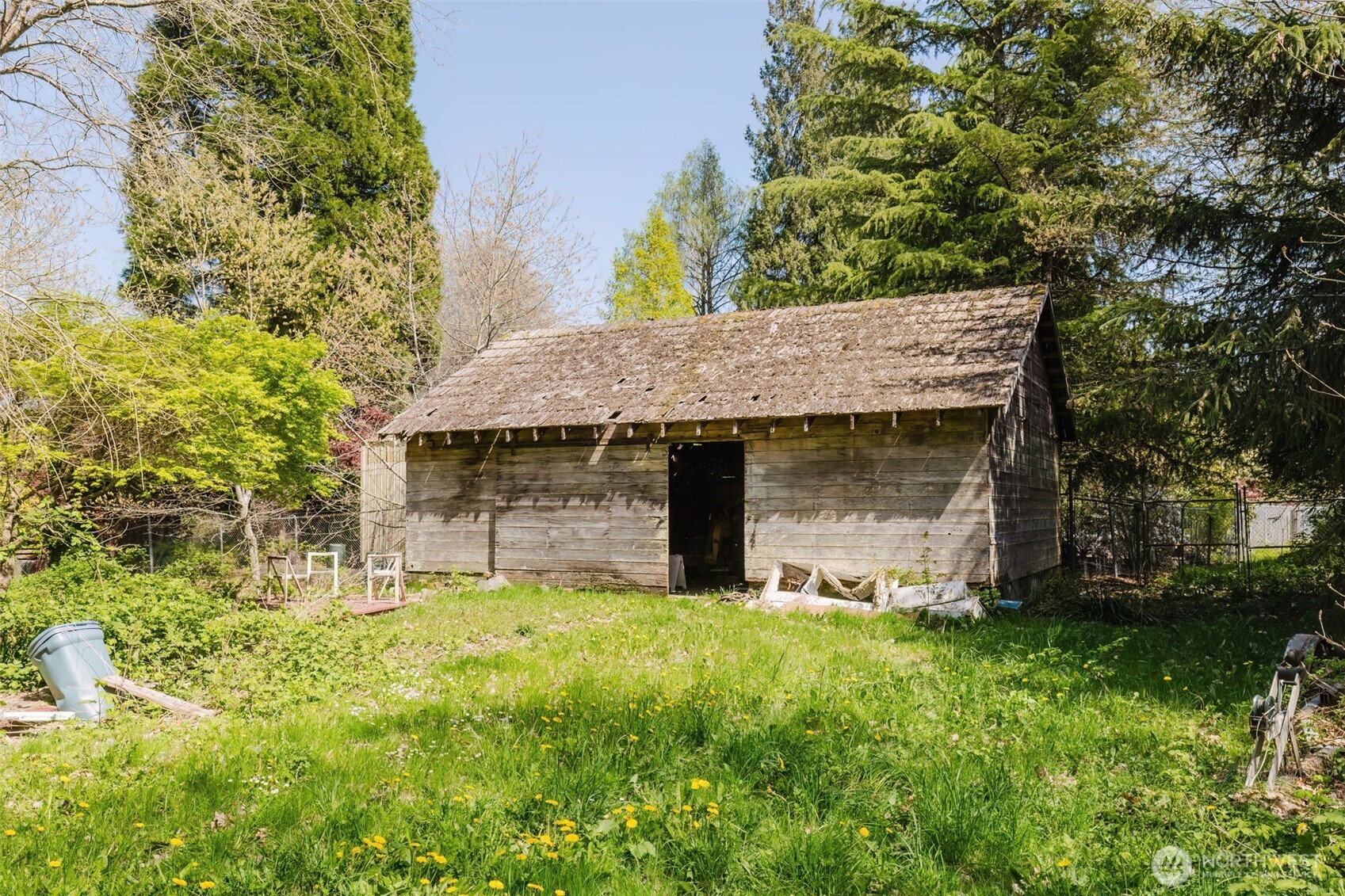 105 Schoolhouse Road Brinnon, WA 98320 - Photo 34 of 39 a view of a wooden house with a yard