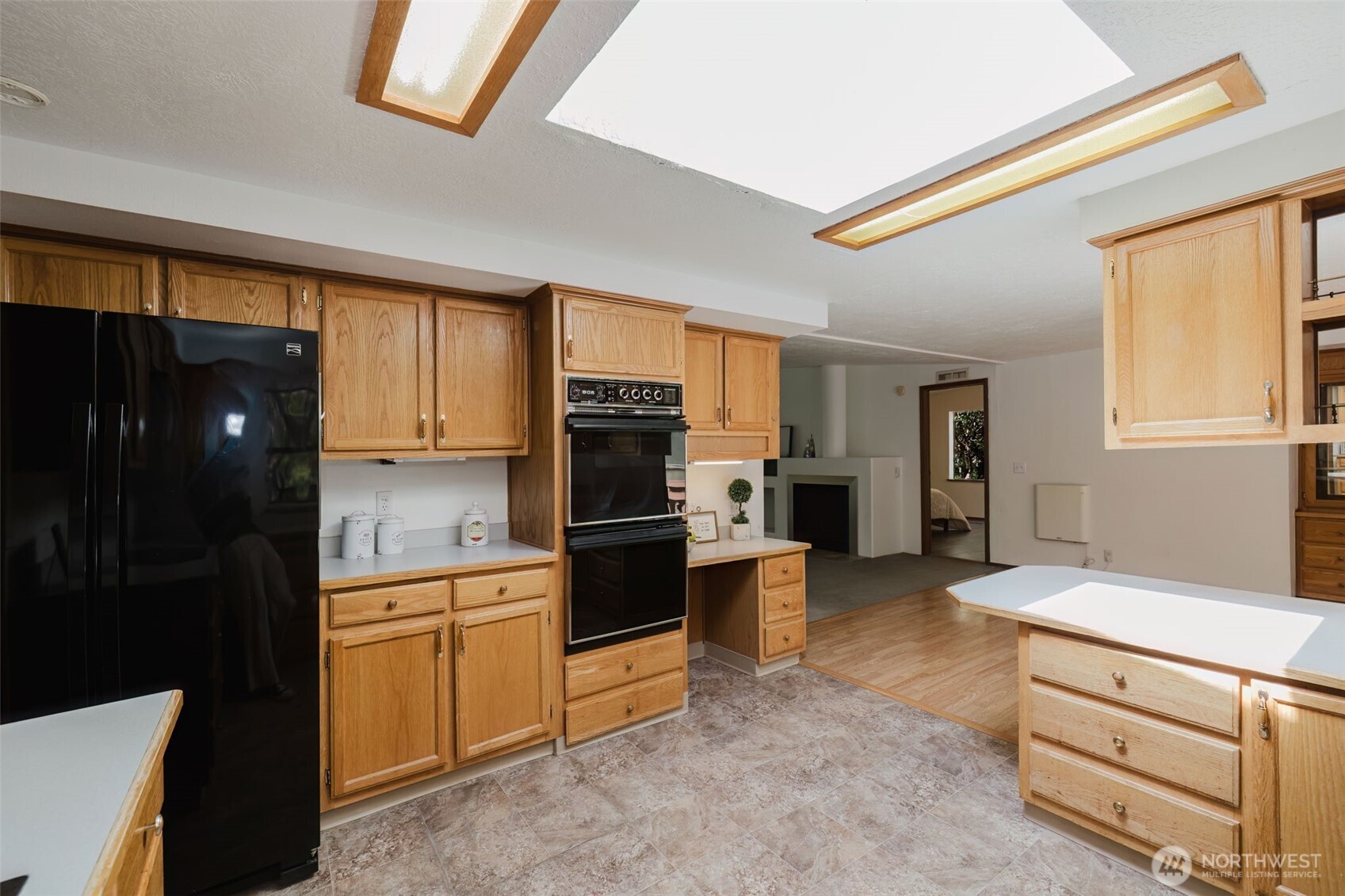 105 Schoolhouse Road Brinnon, WA 98320 - Photo 6 of 39 a kitchen with stainless steel appliances granite countertop a refrigerator and a stove top oven