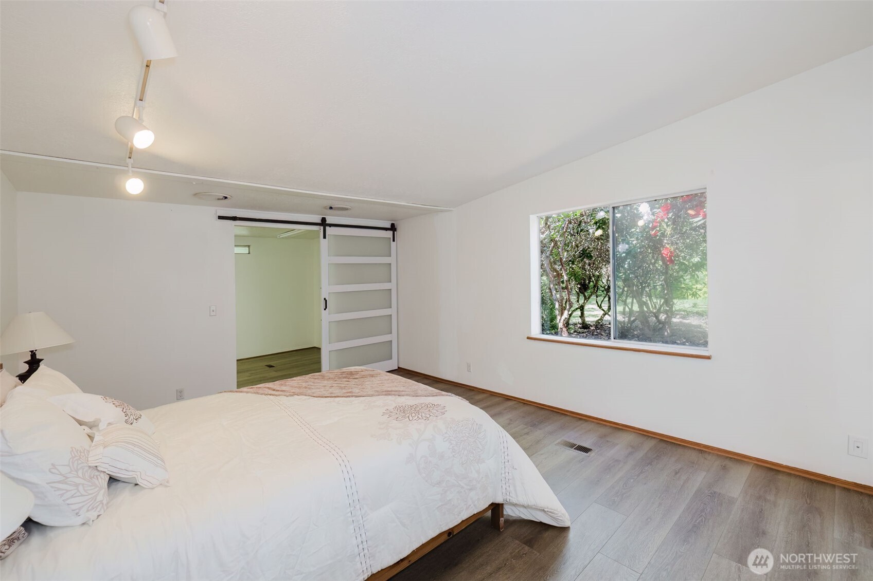 105 Schoolhouse Road Brinnon, WA 98320 - Photo 7 of 39 a bedroom with a bed and a window