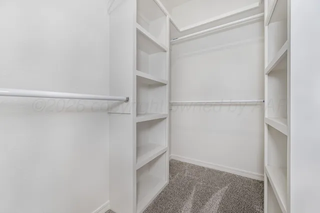 a view of an empty walk in closet