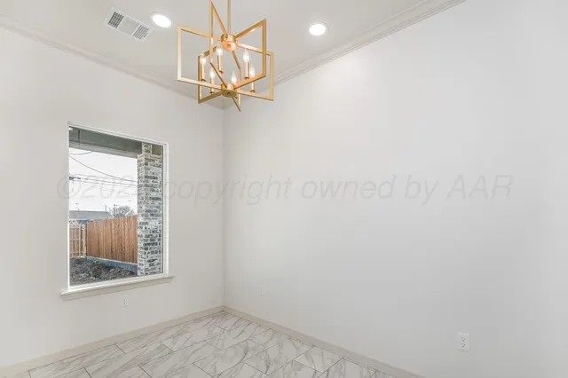 a view of a room with window and a fan