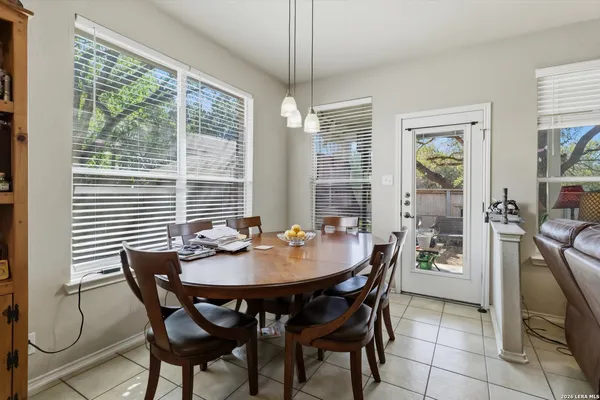 a dining room with furniture and window