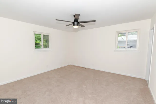 a bathroom with a toilet a sink a bathtub and mirror