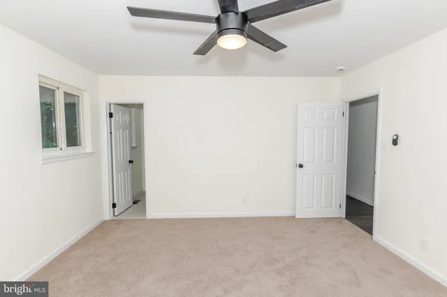 a bathroom with a shower sink and mirror