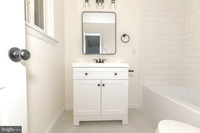 a view of a hallway with a white walls