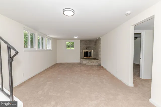 a view of a room with wooden walls