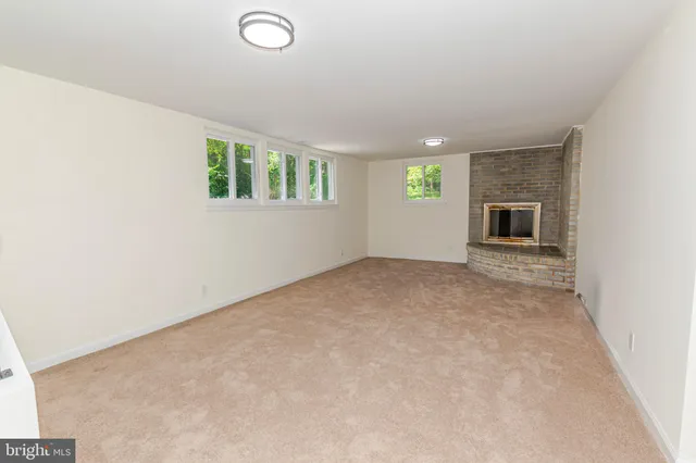 a view of a fireplace with an empty room