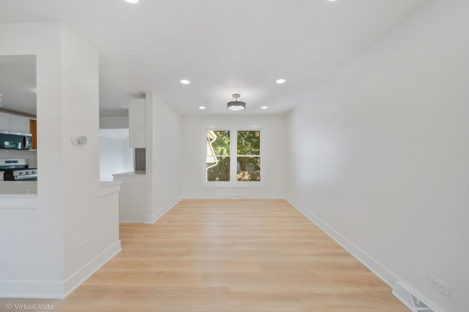 451 Alcester Court Bolingbrook, IL 60440 - Photo 11 of 22 a view of an empty room with wooden floor and a window