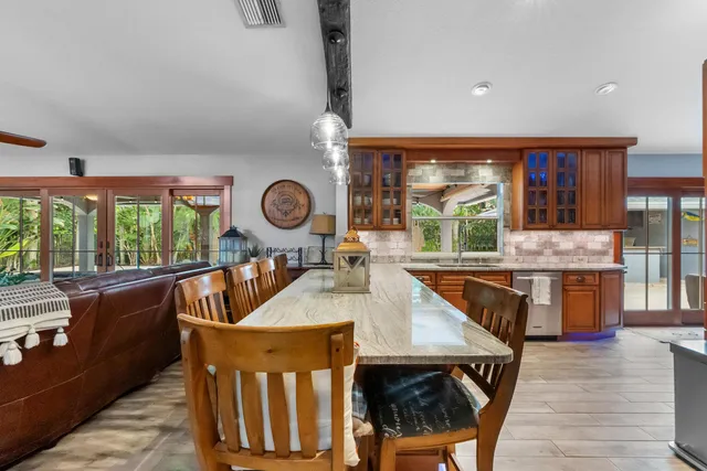 a dining room filled with table and chairs