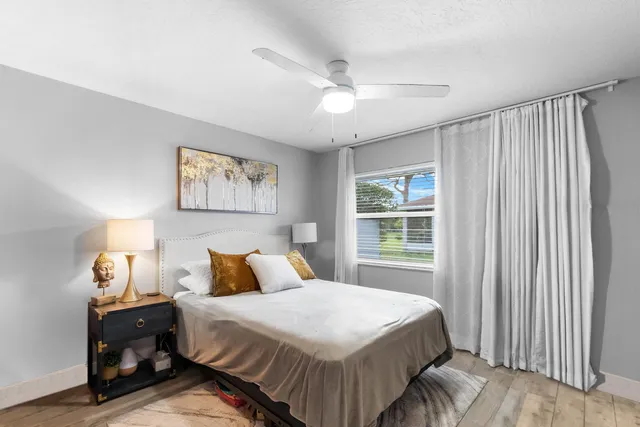 a bathroom with a double vanity sink mirror and shower
