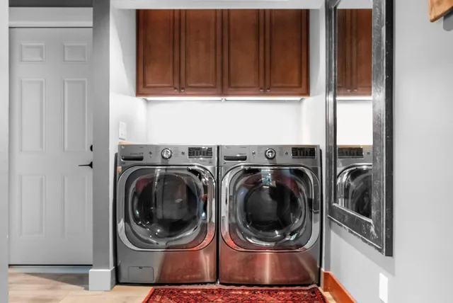 a view of a patio with table and chairs potted plants with wooden floor