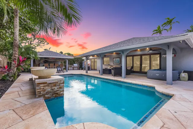 a view of a swimming pool with a patio