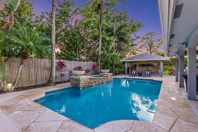 an aerial view of a house with outdoor space